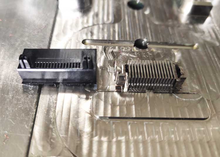 close view of mold for plastic pin connector