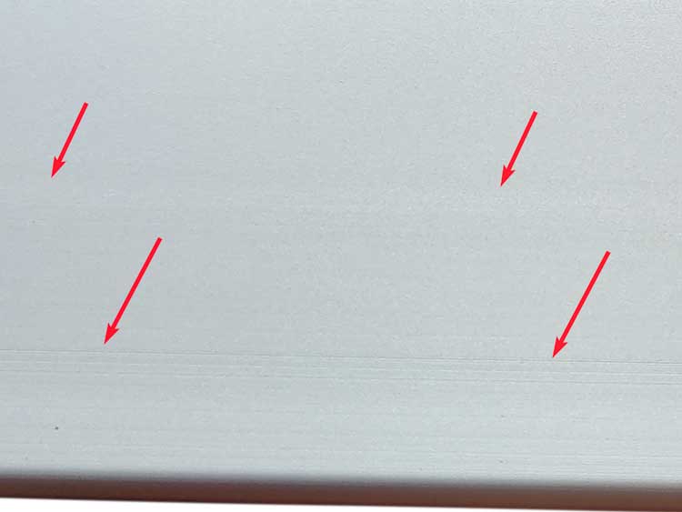 close view of mold marks on anodized aluminum extrusions