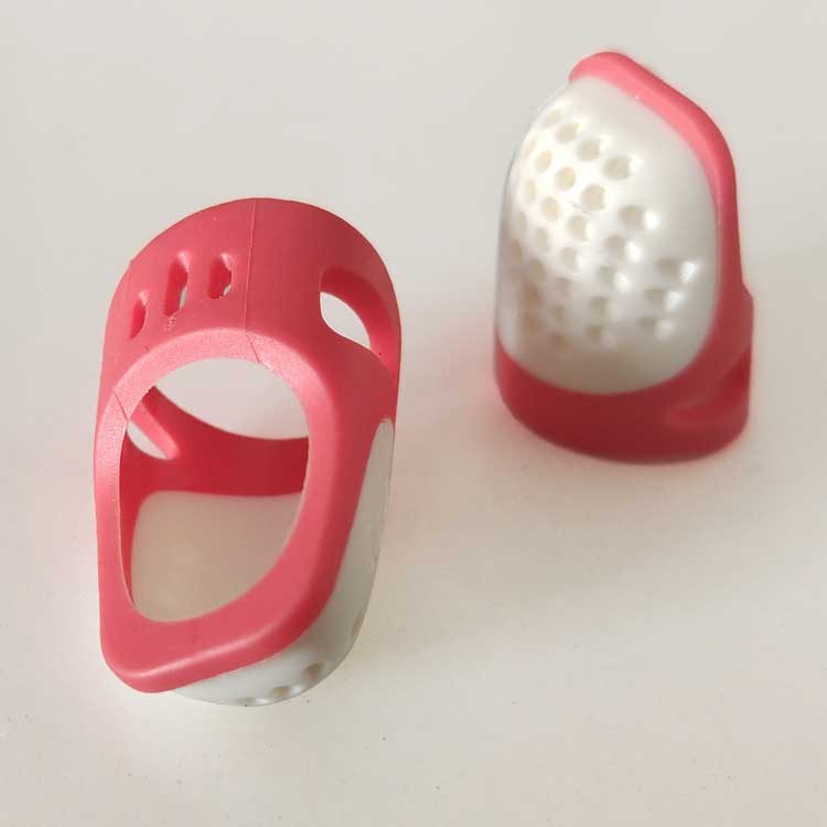 plastic thimble top and side views