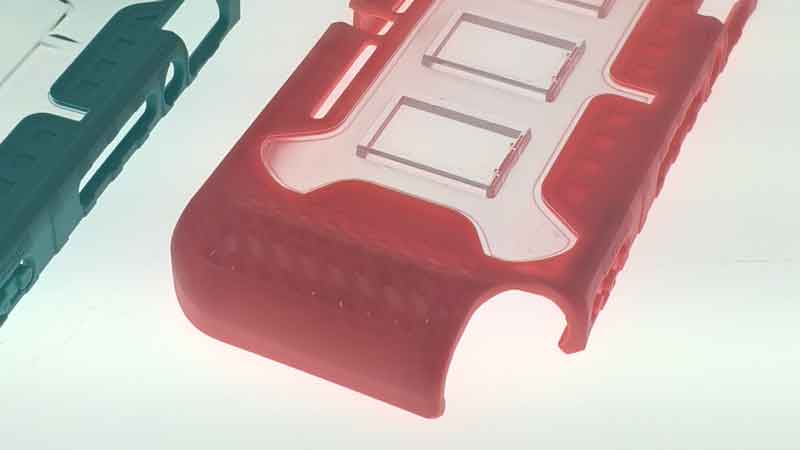 The PC+TPU overmolded phone cases demonstrating material compatibility.
