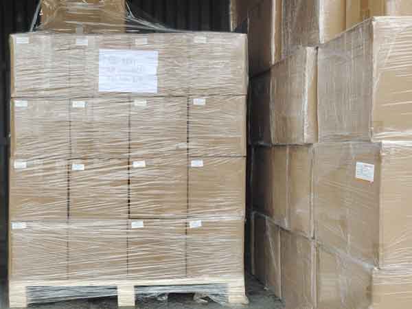 Cartons loading on pallet ready for shipping