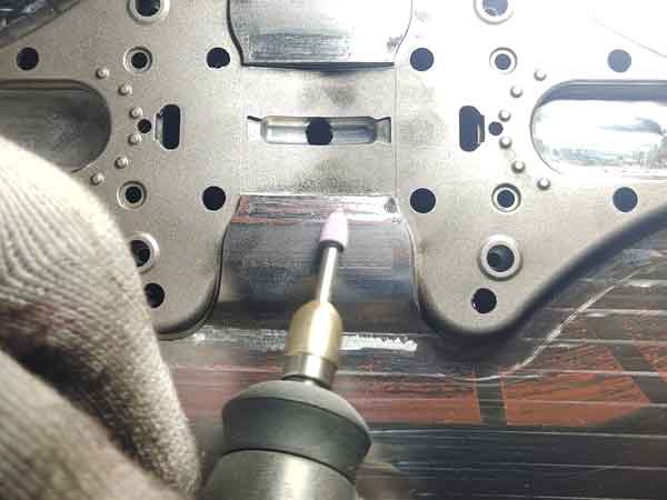 Use a rotary tool to remove excess material and adjust the size in mold manual fitting