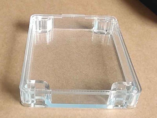 Transparent polycarbonate cover for a weatherproof custom plastic enclosure