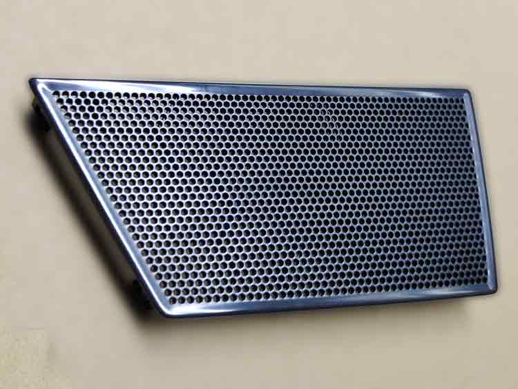 Front side of ABS plastic speaker cover featuring a high-gloss surface and fine perforated holes