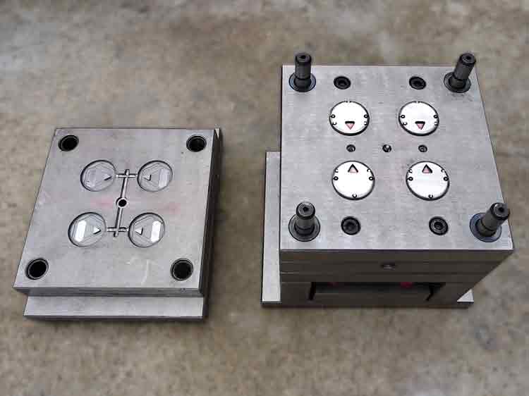 Four-cavity injection mold used to produce transparent covers for the custom plastic toy, designed with edge gates for efficient molding and consistent quality.